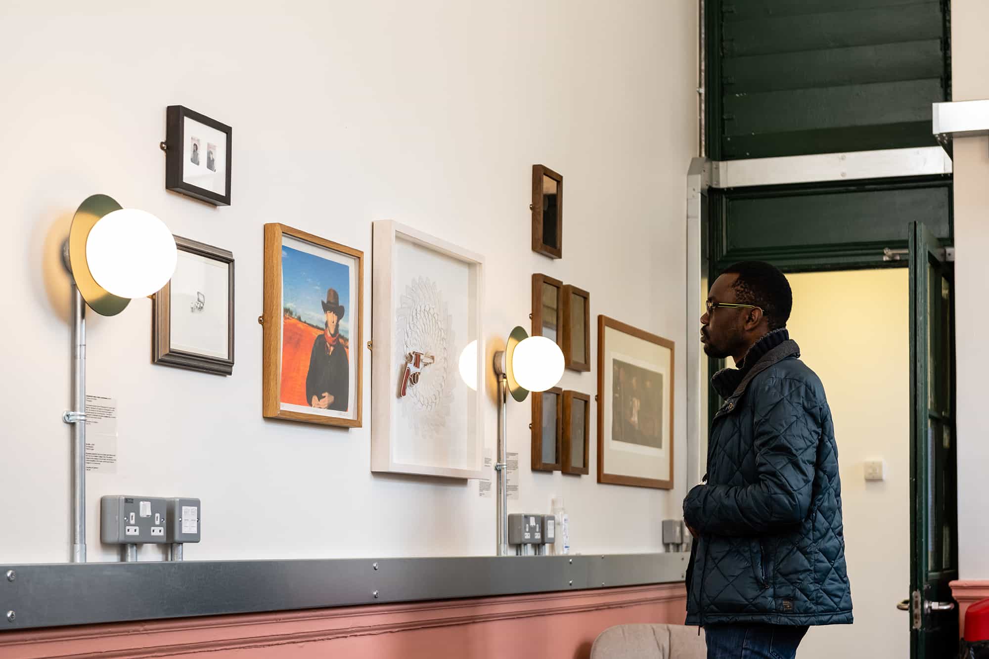 Student looking at artwork at Camberwell College of Arts | Photographer: Ana Blumenkron