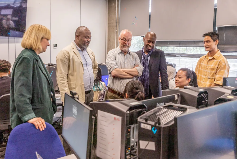 Clive Myrie with London College of Communication staff and students, 2024, LCC, UAL | Photograph by Dave George Creative